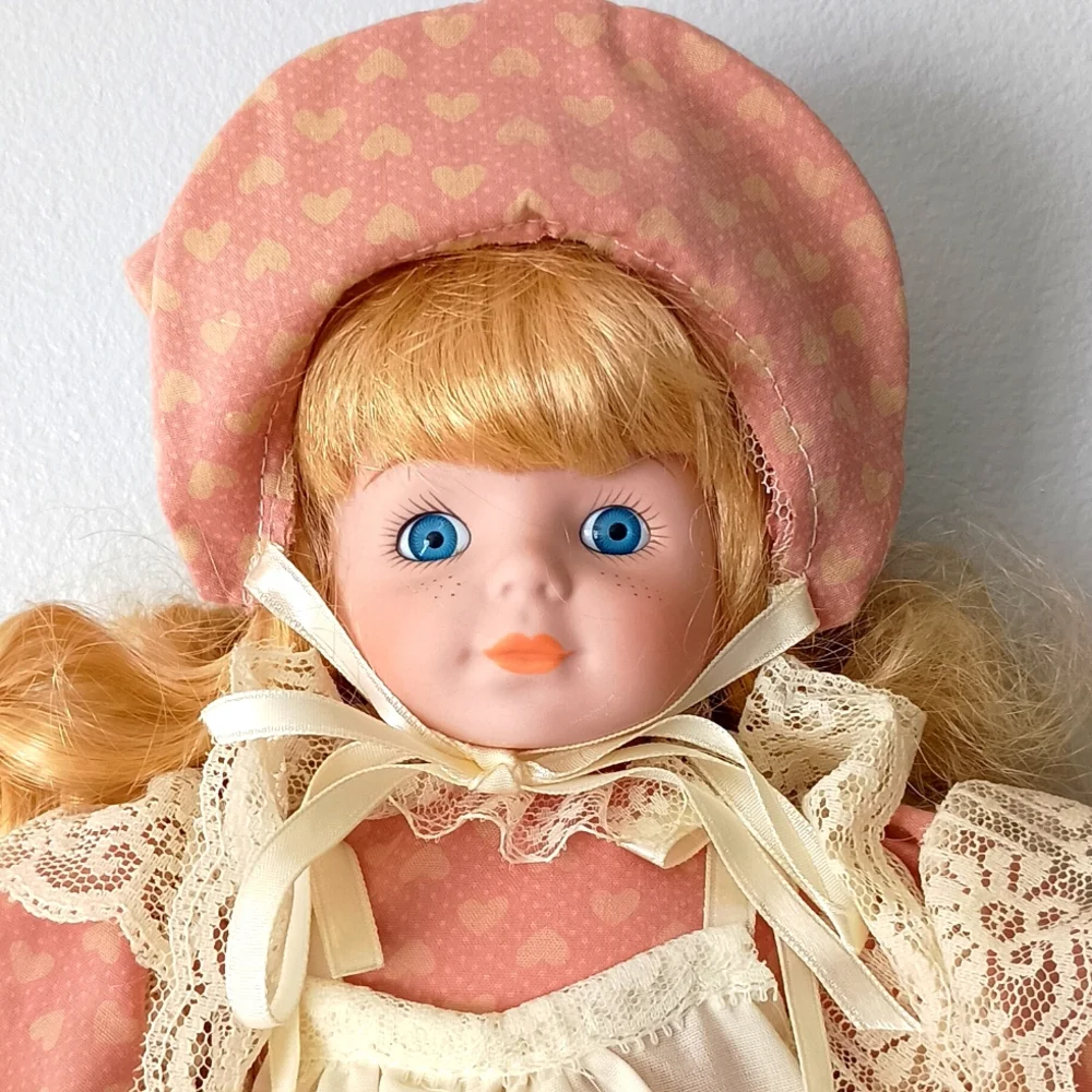 Vintage Porcelain Doll with Pink Dress and Bonnet by Dynasty Dolls